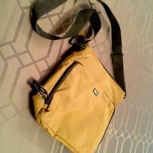 Daily wear unisex handbag. Many pockets holds IPAD